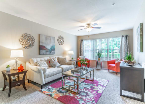 our apartments offer a living room with a couch coffee table and tv