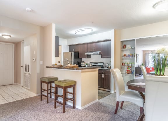a kitchen and dining area in a 555 waverly unit