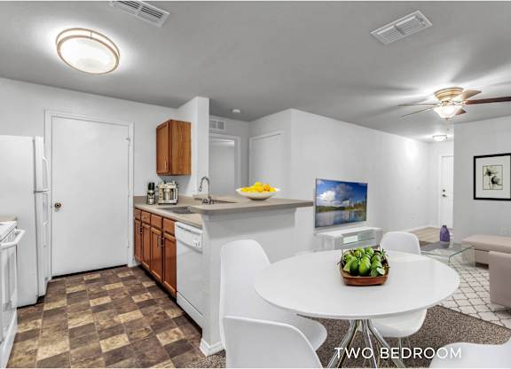 A two bedroom apartment with a kitchen and living room.