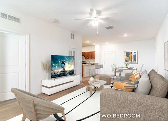 A living room with a television and a couch.