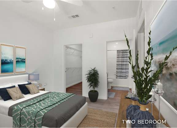 A bedroom with a bed, a plant, and a painting on the wall.