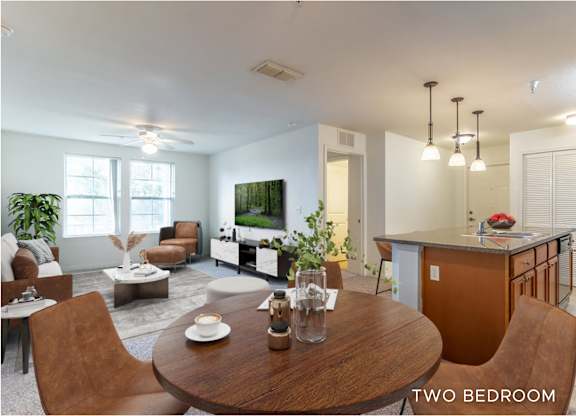 A modern living room with a dining table and chairs.