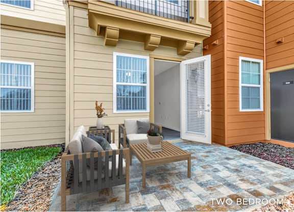 A two bedroom apartment with a patio and a balcony.