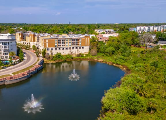 a view of a lake with buildings in the background