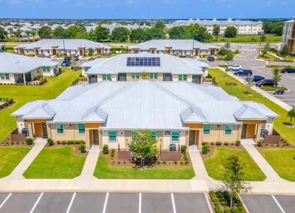 an aerial view of a building with a large metal roof
