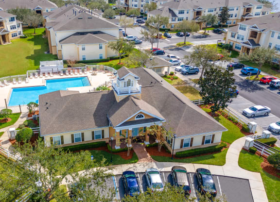 an aerial view of a house with a swimming pool
