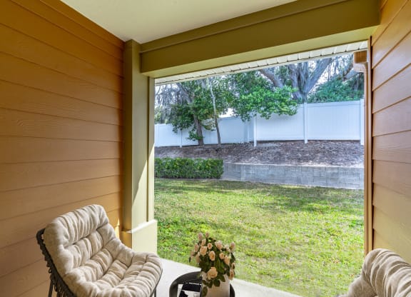 a living room with a large window overlooking a yard