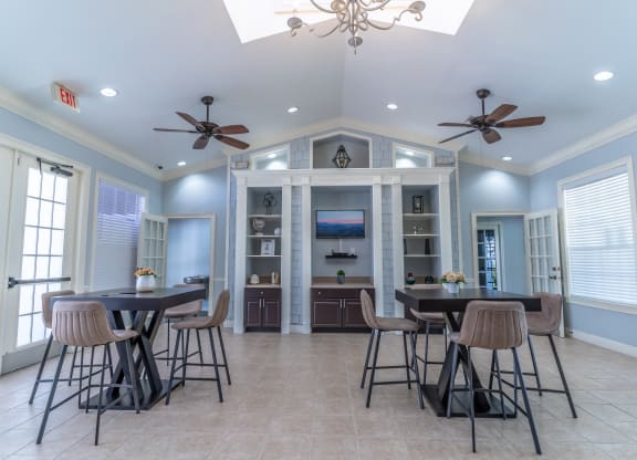 clubhouse area with tables and tv
