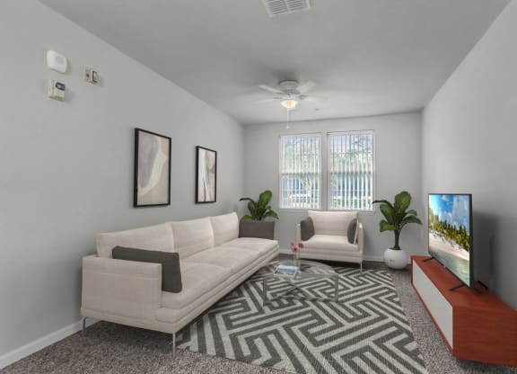 another view of a living room with a couch a coffee table and a tv