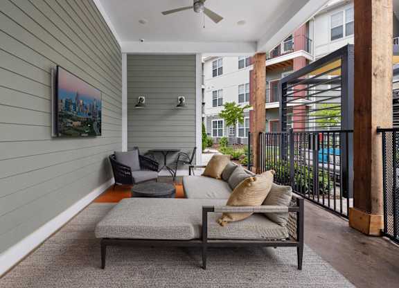 Patio with Couch at Giddy Hall Apartments, Charlotte