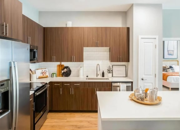 Spacious Kitchen with Breakfast Bar, Stainless Steel Appliances, and Ample Cabinetry