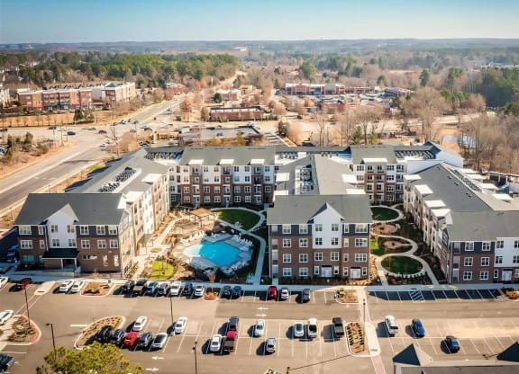 Aerial View of Alta Wren Apartments with Landscaped Courtyards, Pool Area, and Resident Parking