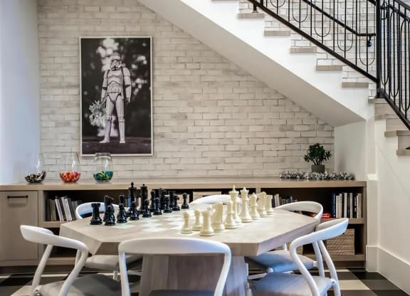 Clubhouse Lounge with Modern Chess Table, Built-In Bookshelves & Artful Decor