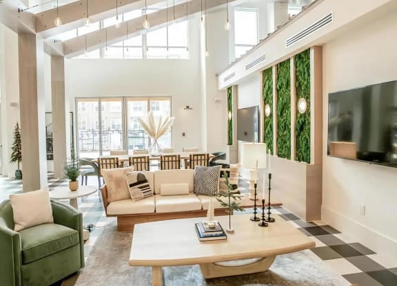 Open-Concept Clubroom with Vertical Garden Wall, Lounge Seating & Dining Table