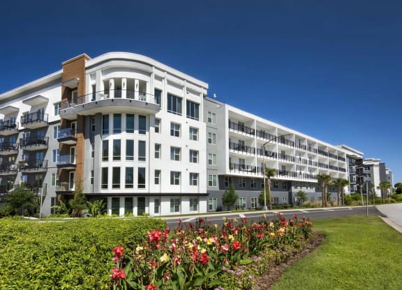 Anchor Riverwalk Apartment Community with Landscaped Grounds and Corner Window Design