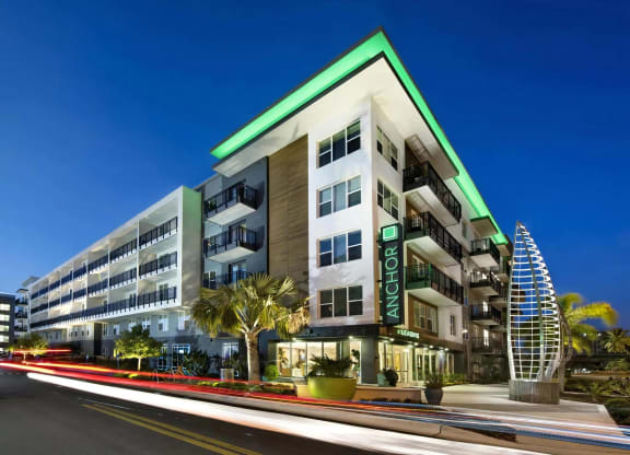 Anchor Riverwalk Entrance Featuring Illuminated Sculpture and Modern Leasing Center with Sign