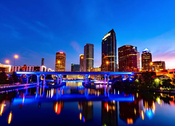 Evening Skyline of Tampa with Vibrant Lights and River Views by Anchor Riverwalk