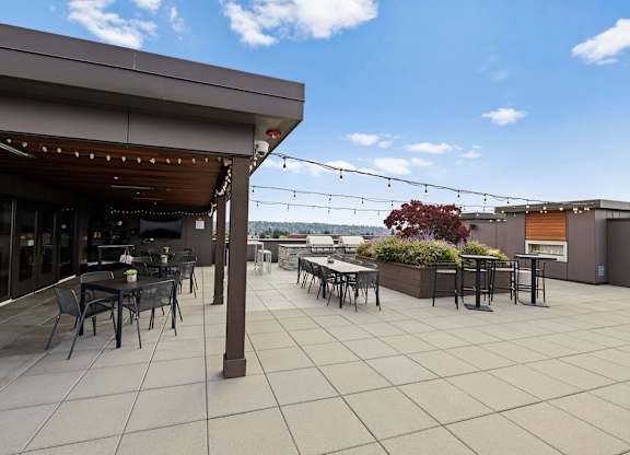 A patio with tables and chairs is shown.