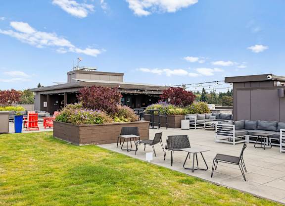 A patio area with a table and chairs.