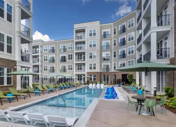 Broadstone Upper Westside Community Pool Resort Style Pool with In Pool Chaise Lounges
