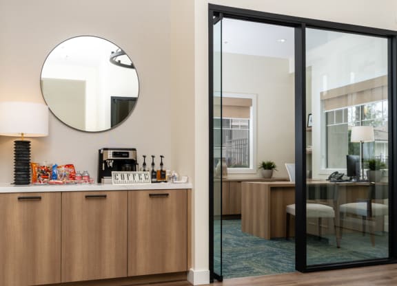 a room with a bar and a mirror and a dining room