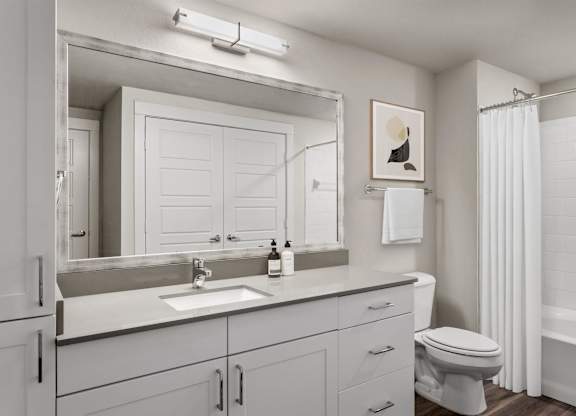 Gateway Arvada Ridge Spacious Bathroom with Large Vanity and Bright Lighting