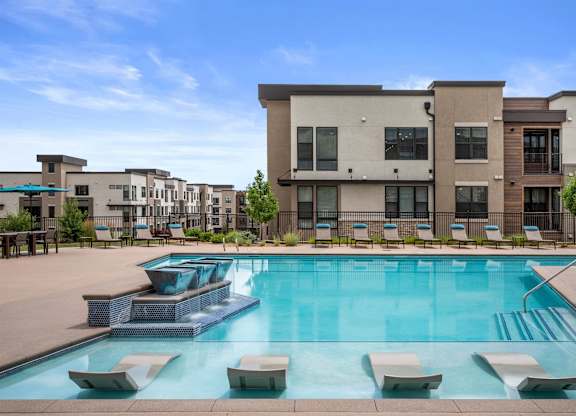 Gateway Arvada Ridge Sparkling Pool with In-Pool Loungers and Relaxing Deck Seating