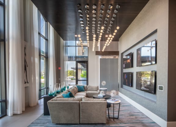 Community Lounge with TV Wall and Plush Sectional Seating