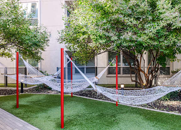 Outdoor Courtyard with Cabanas, Hammocks, and Peaceful Zen Garden