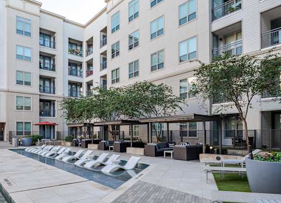Outdoor Courtyard Featuring Shaded Seating and Stylish Poolside Vibe
