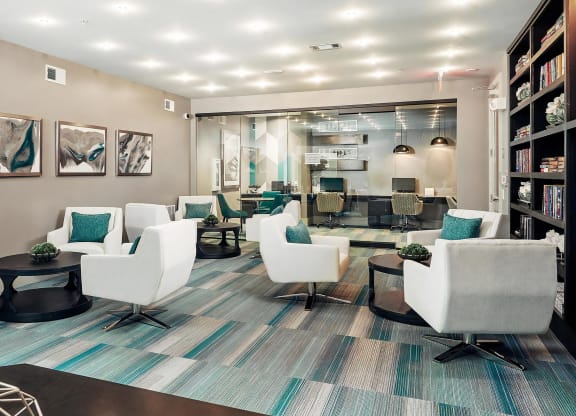 Clubhouse Lounge with Modern Seating and Glass-Enclosed Business Center