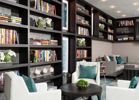 Lounge with Floor-to-Ceiling Library Shelves and Modern Seating