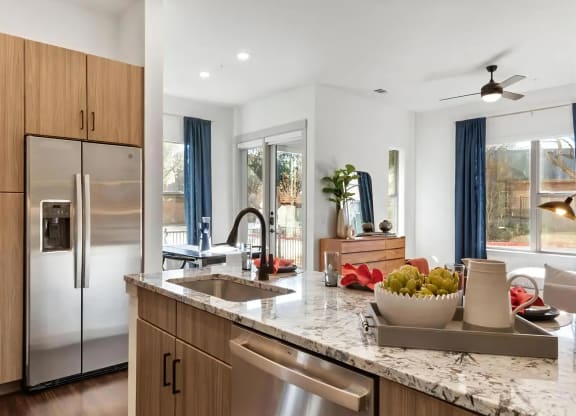 Kitchen with Stainless Steel Refrigerator and Built-In Pantry Cabinets
