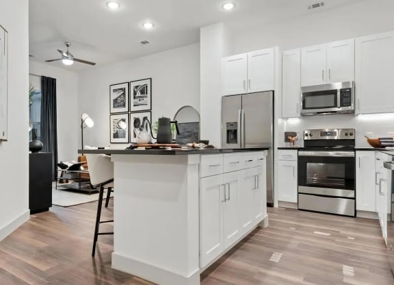 Apartment Interior with White Cabinets and Combined Living Space