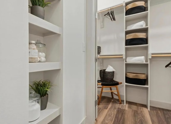Walk-In Closet with Open Shelves, Hanging Rods, and Storage Baskets