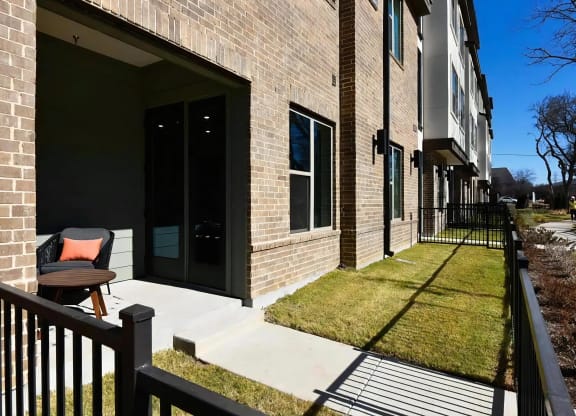 Ground-Level Patio with Fenced-In Green Space and Private Entry