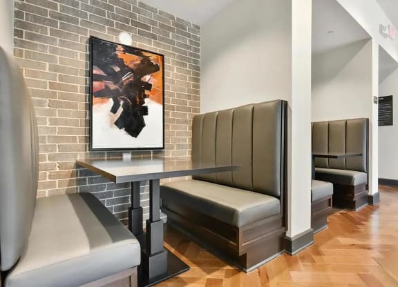 Clubhouse Lounge with Private Booth Seating and Accent Brick Wall