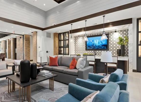 Resident Clubroom Featuring TV Wall, Bar Seating & Lounge Area