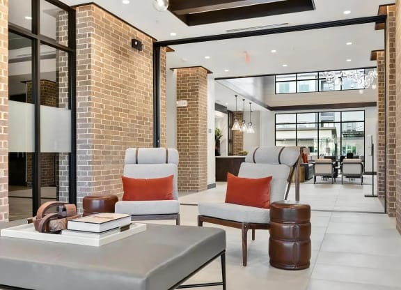 Comfortable Clubhouse Lounge with Natural Light and Courtyard Access