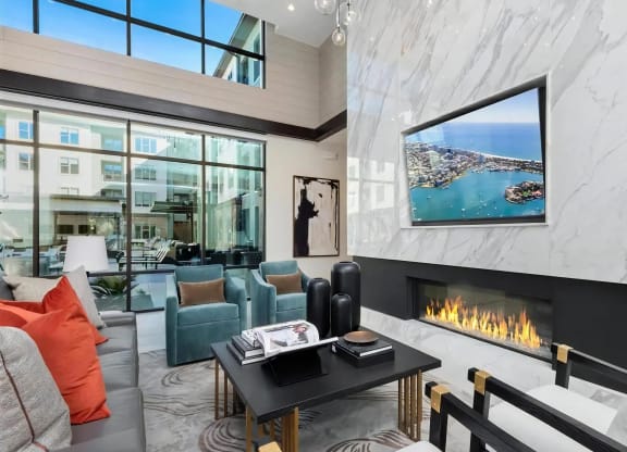 Cozy Resident Lounge with Floor-to-Ceiling Windows and Fireplace