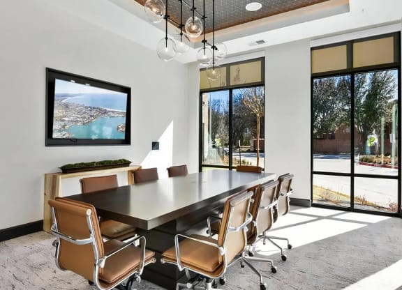 Glass-Enclosed Meeting Room with Comfortable Office Seating