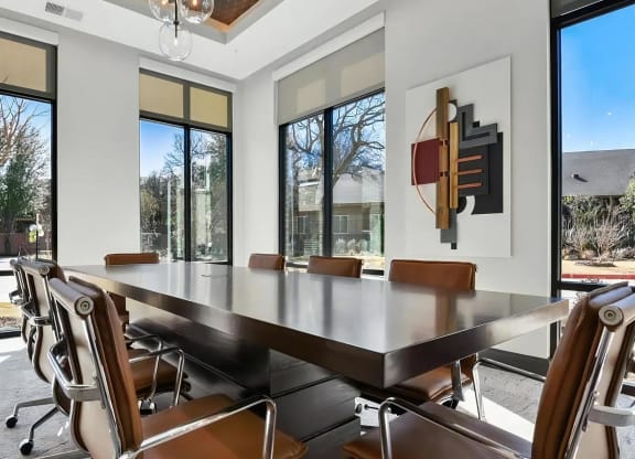 Modern Conference Space with Leather Chairs and Wall Art