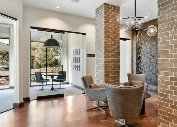 Contemporary Leasing Office with Brick Columns and Artful Touches