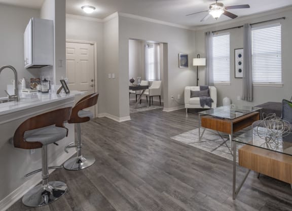 a living room with a kitchen and a dining room