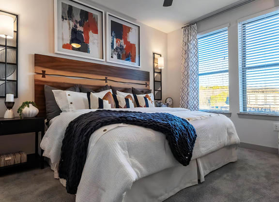 Well-Lit Bedroom Featuring Modern Décor and Ample Natural Light