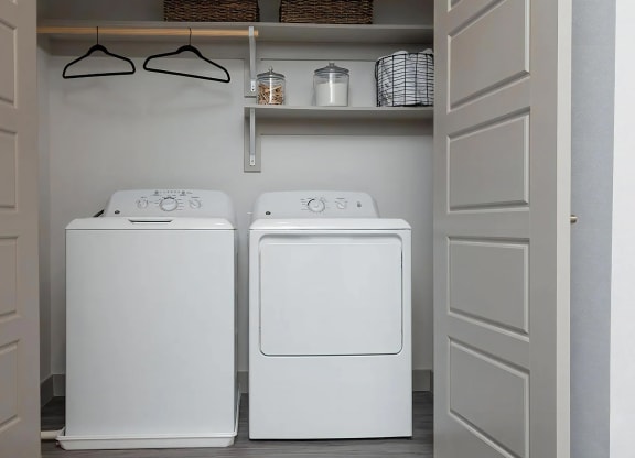 In-Unit Laundry with Full-Size Washer and Dryer and Built-In Shelving
