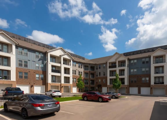 Parking Lot View of The Harper Apartments with Attached Garages