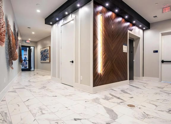 Modern Clubhouse Hall with Sleek Wood and Lighting Accents