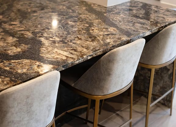 Clubhouse Lounge with Elegant Granite-Top Bar and Modern Stools