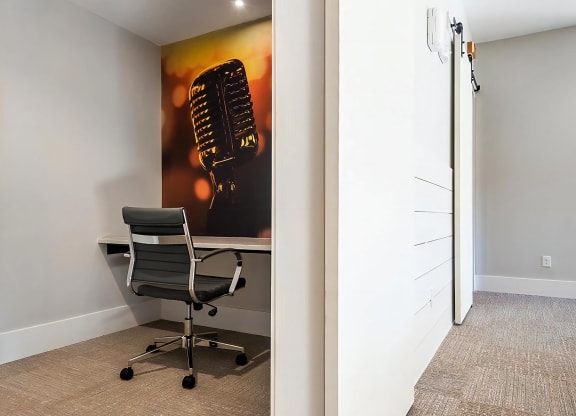 Small Workspace with Chair and Microphone-Themed Wall Art